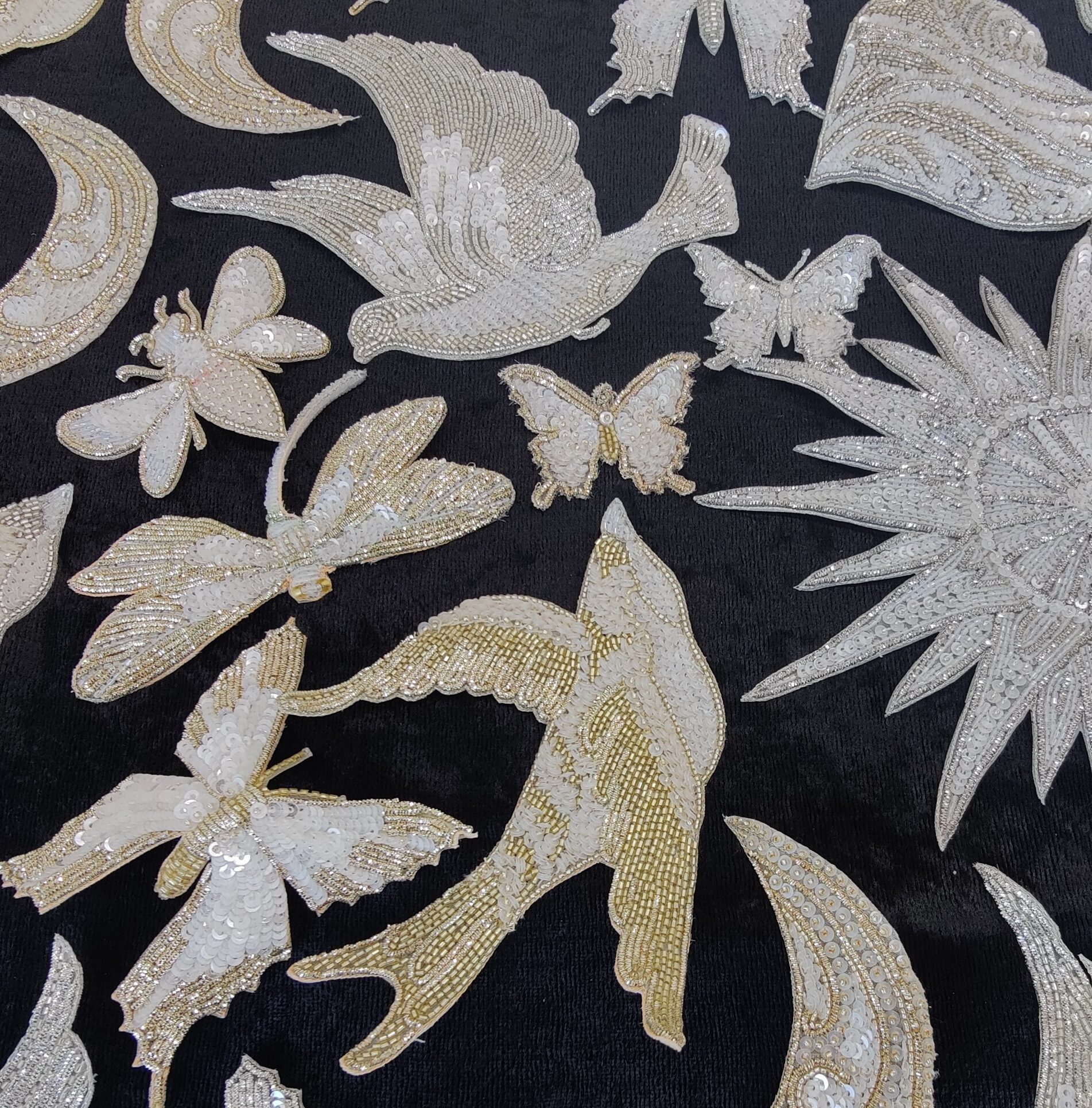 Hand-beaded appliques to personalise a bridal gown- birds, stars, dates, moon, butterflies, etc